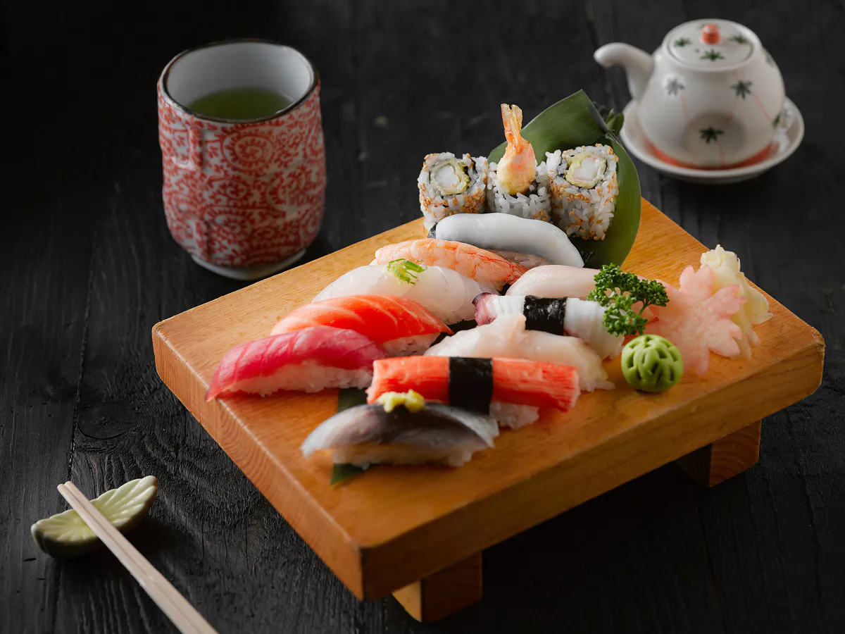 Assorted nigiri sushi platter with green tea and teapot at Kanji Asian Bistro & Sushi Bar，an Asian Fusion Restaurant in Newark