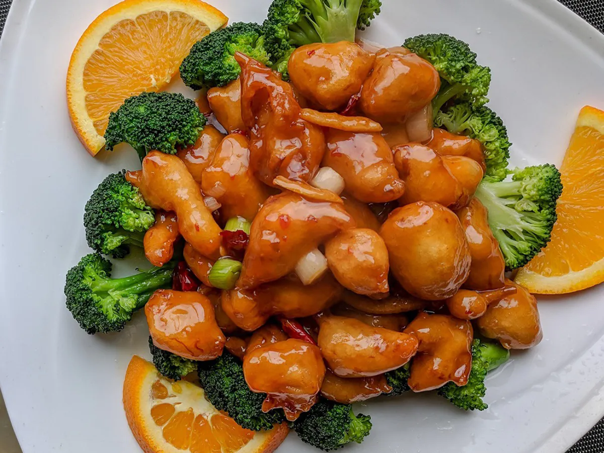 Sweet orange glazed chicken with fresh broccoli and orange slices at Kanji Asian Bistro & Sushi Bar，an Asian Fusion Restaurant in Newark