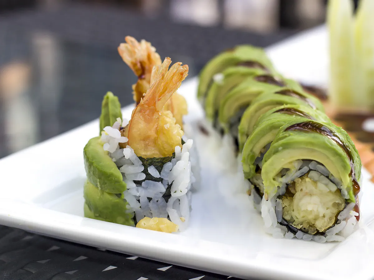 Tempura shrimp avocado sushi rolls on white plate at Kanji Asian Bistro & Sushi Bar，an Asian Fusion Restaurant in Newark